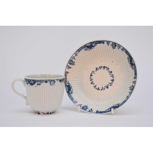 10 - A Worcester coffee cup and saucer, circa 1765-75, moulded with a narrow band of ribbing and painted ... 