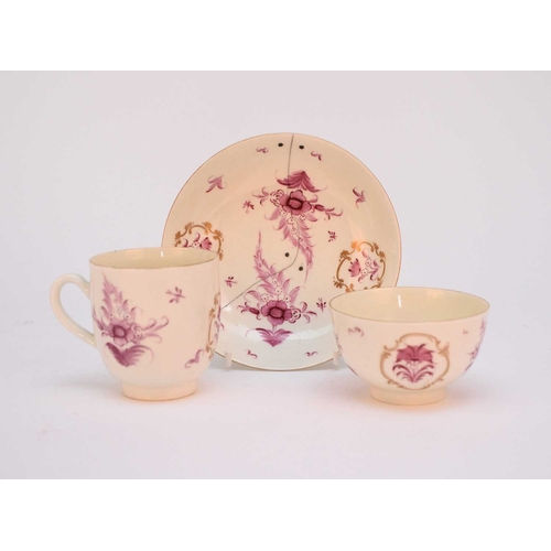 12 - A Worcester trio of a coffee cup, a tea bowl and a saucer, circa 1765-1775, painted in overglaze puc... 