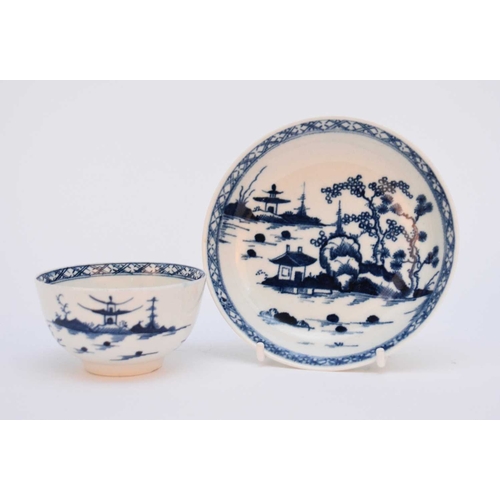 14 - A Worcester tea bowl and saucer, circa 1765-70, painted in underglaze blue with the 'Cannonball' pat... 