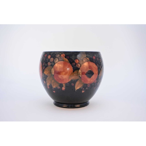 229 - A large William Moorcroft 'Pomegranate' jardiniere, circa 1920s, tubelined with the fruit including ... 