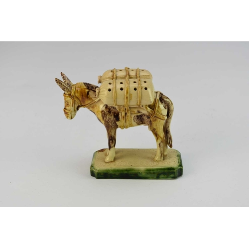 264 - An unusual Continental creamware model of a donkey 19th century decorated with a Whieldon-type glaze... 