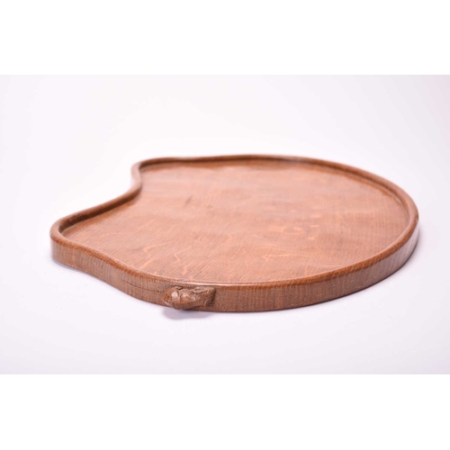 399 - Studio of Robert Mouseman Thompson (Kilburn), an adzed oak tea tray Of kidney shape with signature m... 