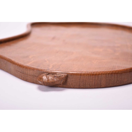 399 - Studio of Robert Mouseman Thompson (Kilburn), an adzed oak tea tray Of kidney shape with signature m... 