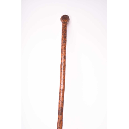 401 - A 19th century incised cane, likely of Colonial Indian origin, the tapering shaft with natural knot ... 