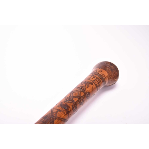 401 - A 19th century incised cane, likely of Colonial Indian origin, the tapering shaft with natural knot ... 