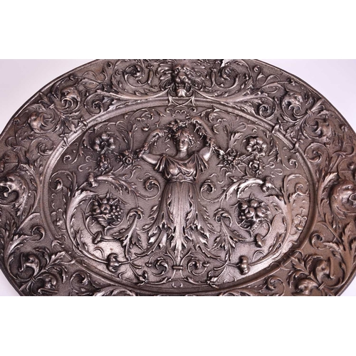 404 - A cast iron neoclassical wall plaque, 19th century Of oval form and cast in relief with a classical ... 