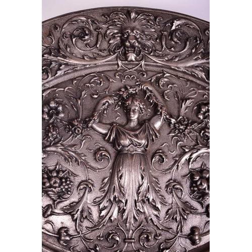 404 - A cast iron neoclassical wall plaque, 19th century Of oval form and cast in relief with a classical ... 