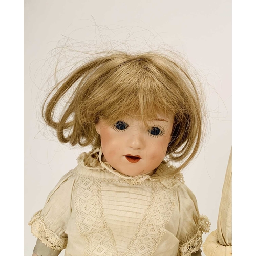 410 - Three German bisque-headed dolls The first Ernst Heubach, no.7, with blond wig, fixed blue eyes and ... 