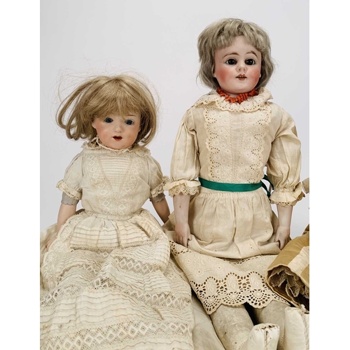 410 - Three German bisque-headed dolls The first Ernst Heubach, no.7, with blond wig, fixed blue eyes and ... 