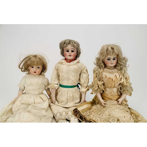 410 - Three German bisque-headed dolls The first Ernst Heubach, no.7, with blond wig, fixed blue eyes and ... 