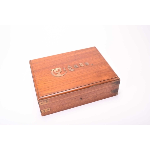 437 - A campaign type walnut cigar box, circa 1900 Of rectangular outline, the corners with brass mounts, ... 