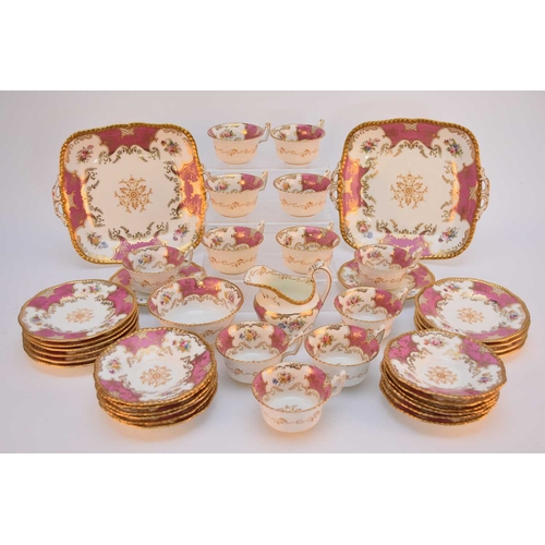 45 - A Coalport pink batwing tea service, circa 1900-10, twelve-person setting comprising twelve tea cups... 