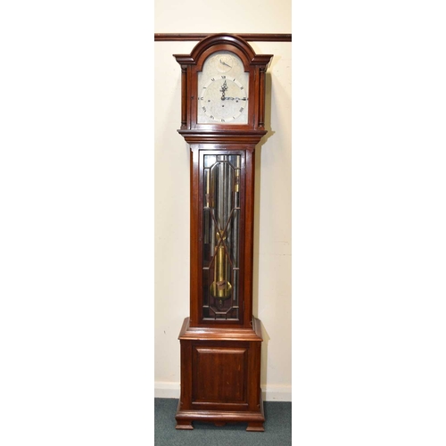 454 - An Edwardian mahogany musical longcase clock The case with astragal glazed trunk, the arched 10.5in ... 