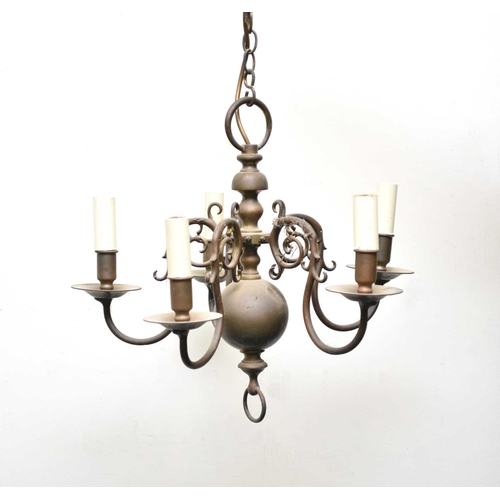 460 - Two Dutch style brass chandeliers Both fitted for electricity, both with baluster stems, the first i... 