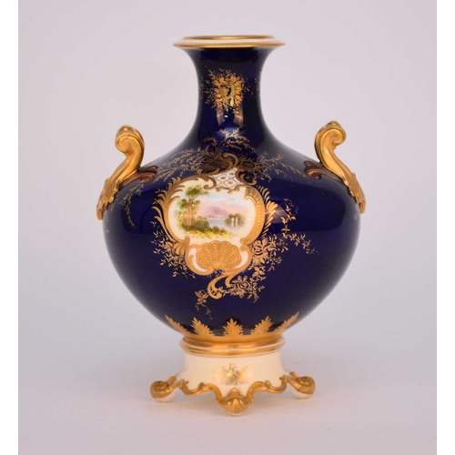 59 - A Coalport vase, circa 1891-1919 of twin-handled form on raised scrolled foot, the dark blue ground ... 