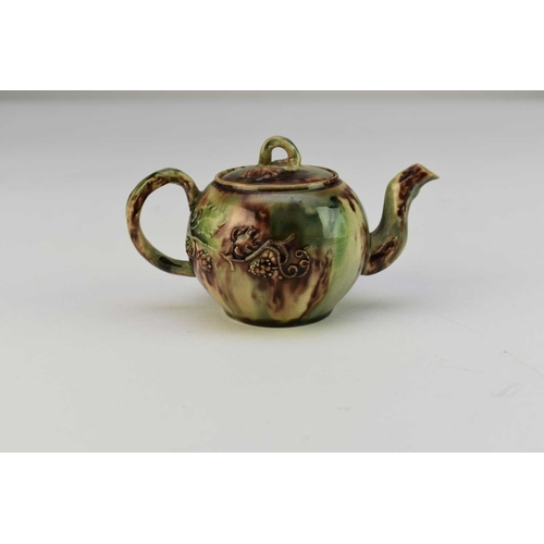 8 - A small Staffordshire 'Whieldon' creamware teapot and cover circa 1750 the globular body applied wit... 