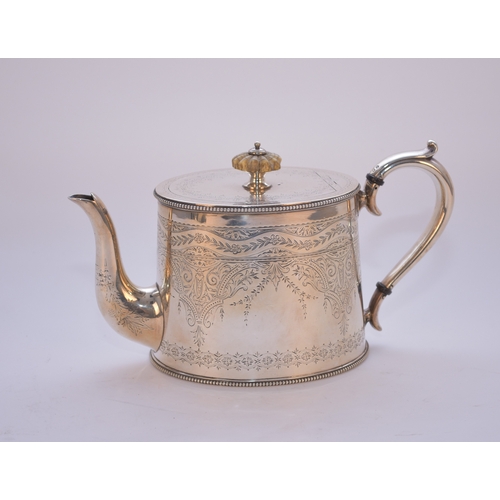 11 - A Victorian silver teapot, Elkington & Co, Birmingham 1873, of oval form with bright cut engraved de... 