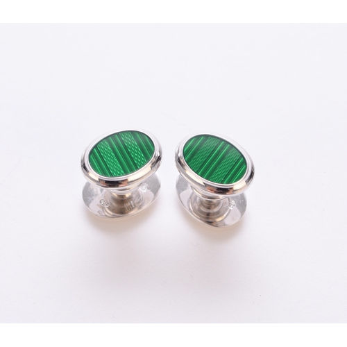 118 - A pair of Dunhill silver and green enamel cufflinks, each with oval green enamel engine turned plaqu... 