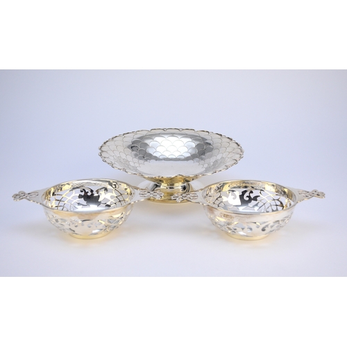 20 - A near pair of Edwardian silver bowls, Sheffield 1907 & 1908, each wih decorative pierced body and t... 