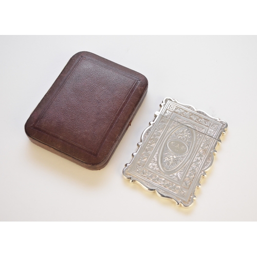 22 - A Victorian silver card case, George Unite, Birmingham 1870, with bright cut engraved decoration and... 