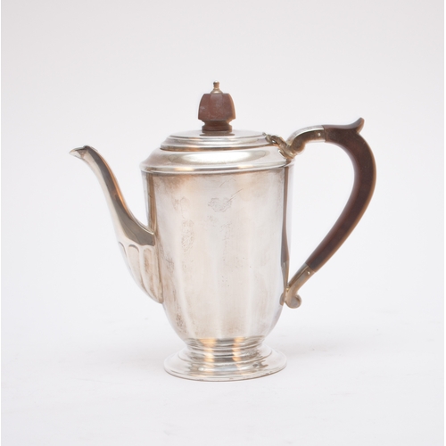 38 - A silver coffee pot, Mappin & Webb, Sheffield 1935, of faceted form and raised on spreading circular... 