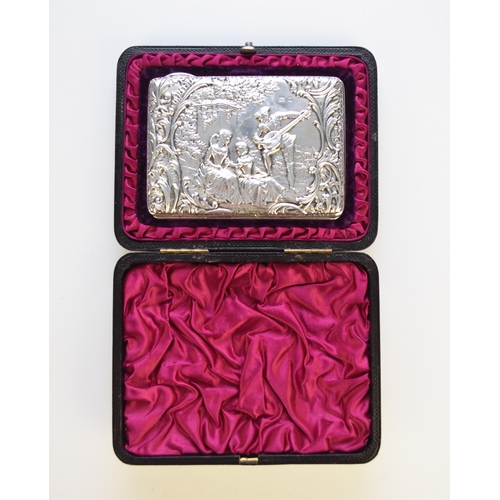 39 - A cased Edwardian silver card/stamp case, Sydney & Co, Birmingham 1903, with figural decoration to o... 