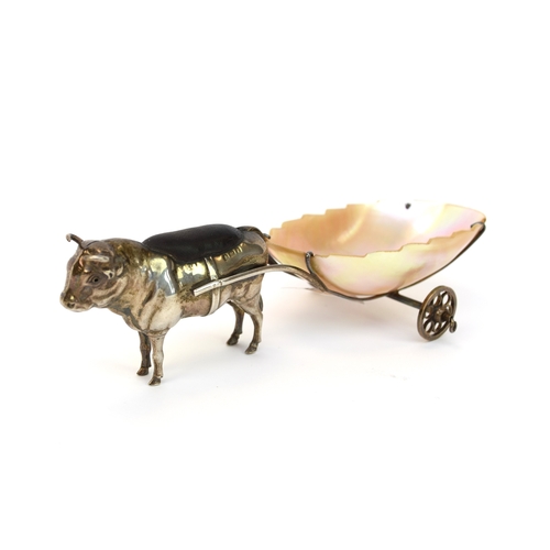 41 - An Edwardian novelty silver pin cushion in the form of a bull with a mother of pearl cart, Adie and ... 