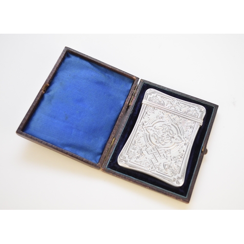 42 - A Victorian silver card case, Edward Smith, Birmingham 1860, with bright cut engraved decoration, 10... 