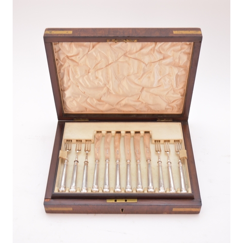 52 - An early 20th century cased set of silver dessert knives and forks, Harrison Brothers & Howson, Shef... 