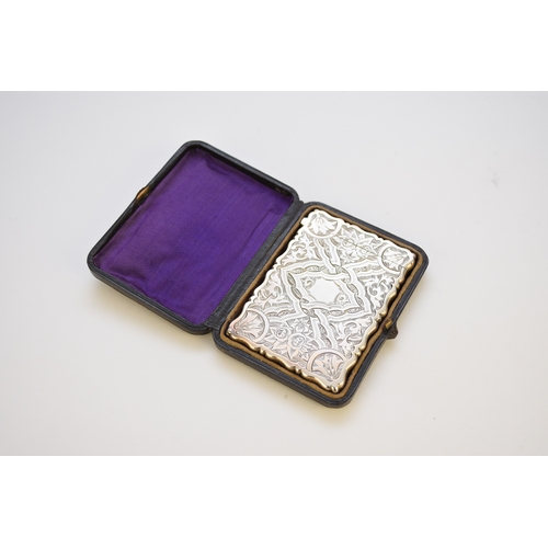 63 - A Victorian silver card case, George Unite, Birmingham 1872, with bright cut engraved decoration and... 