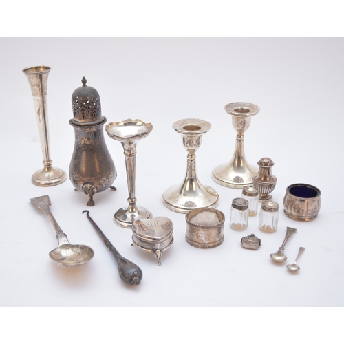 64 - A small collection of silver, comprising; a baluster silver sugar caster, Birmingham 1975, a pair of... 