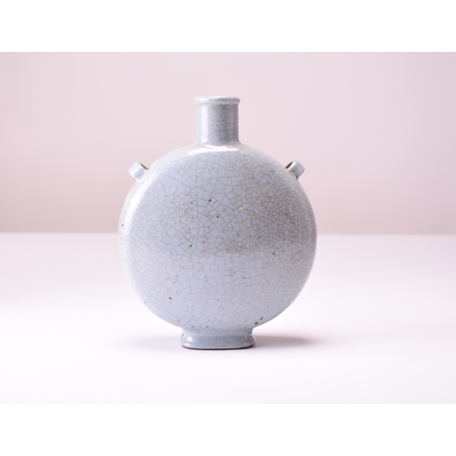 15 - A Chinese guan type moonflask, Yongzheng seal mark and possibly of the period Of circular form with ... 