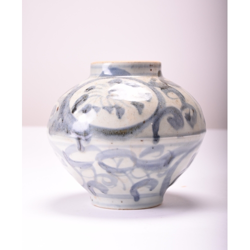 22 - A Chinese blue and white jar, Yuan Dynasty Decorated with stylised flowers and foliage, 18cm high, t... 