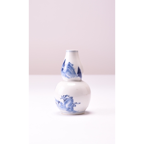 23 - A Chinese blue and white gourd shape vase, probably Qianlong Decorated with a luohan and monks in a ... 