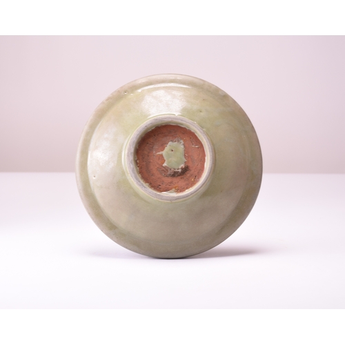 3 - A Chinese Longquan celadon dish, Ming Dynasty Of circular form with everted rim, the centre carved w... 