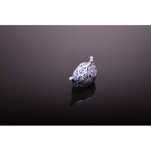 31 - A Chinese porcelain water dropper, late Qing Dynasty Modelled as a lotus bud with bamboo form handle... 