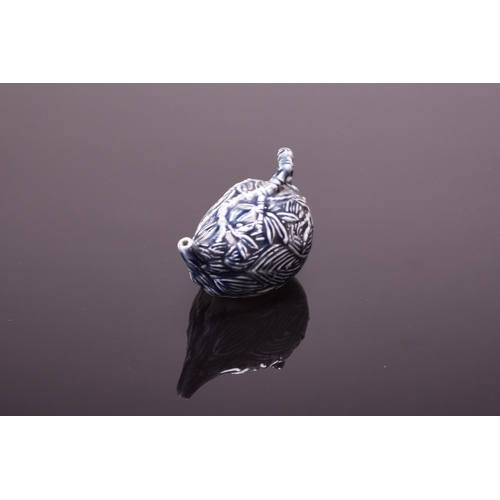 31 - A Chinese porcelain water dropper, late Qing Dynasty Modelled as a lotus bud with bamboo form handle... 