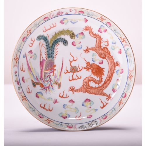 46 - A pair of Chinese dragon and phoenix dishes, Qing Dynasty Of circular form, the deep dishes painted ... 