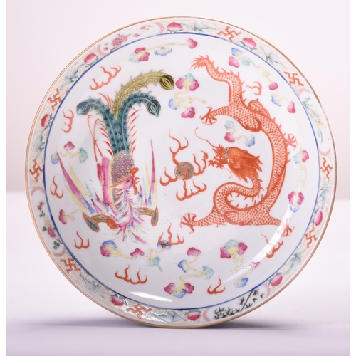 46 - A pair of Chinese dragon and phoenix dishes, Qing Dynasty Of circular form, the deep dishes painted ... 
