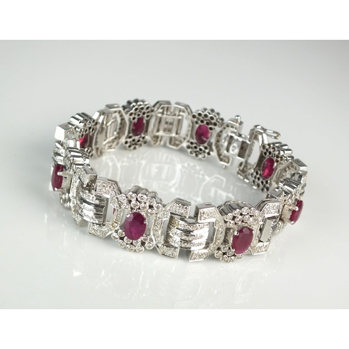 106 - An Art Deco style ruby and diamond bracelet, designed as eight stylised geometric bow links set with... 