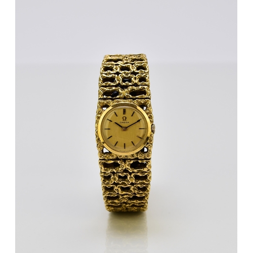 128 - Omega: A lady's 18ct gold bracelet watch Reference: 7131GY / 969620 Date: Circa 1966 Movement: Cal.6... 