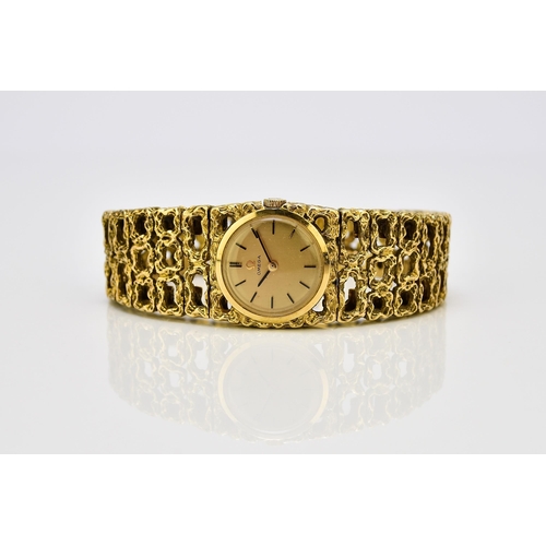 128 - Omega: A lady's 18ct gold bracelet watch Reference: 7131GY / 969620 Date: Circa 1966 Movement: Cal.6... 