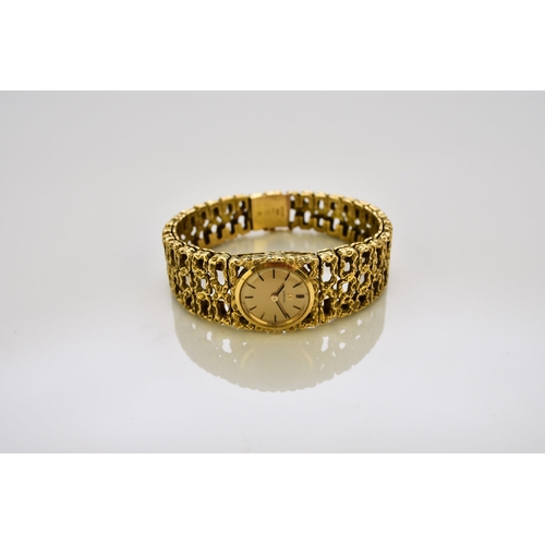 128 - Omega: A lady's 18ct gold bracelet watch Reference: 7131GY / 969620 Date: Circa 1966 Movement: Cal.6... 