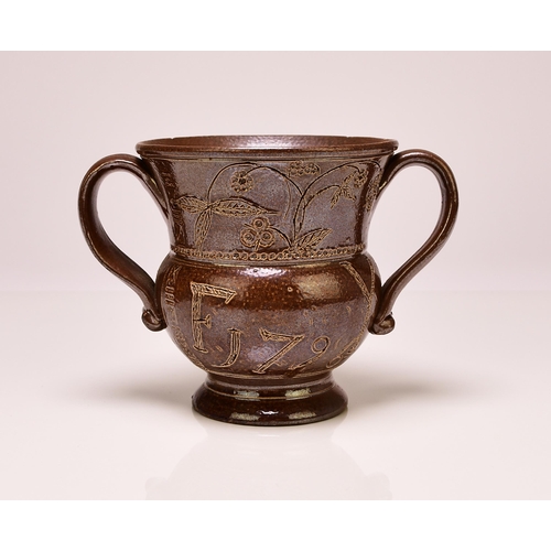 134 - A Belper (Derbyshire) salt-glazed loving cup, inscribed 'F Y' and dated 1796, of twin handled form, ... 