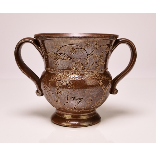 134 - A Belper (Derbyshire) salt-glazed loving cup, inscribed 'F Y' and dated 1796, of twin handled form, ... 