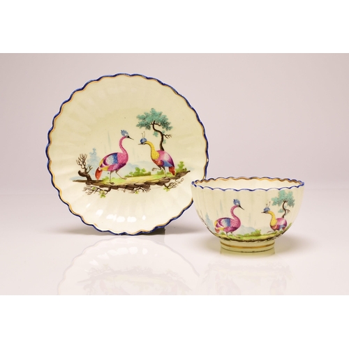 136 - A Caughley porcelain fluted tea bowl and saucer, circa 1783-93, Chamberlain's decorated in polychrom... 