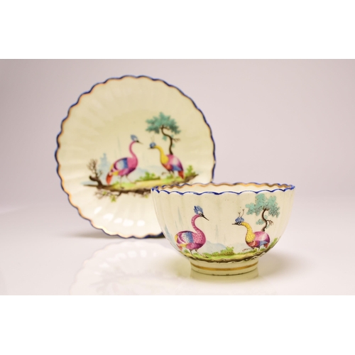 136 - A Caughley porcelain fluted tea bowl and saucer, circa 1783-93, Chamberlain's decorated in polychrom... 