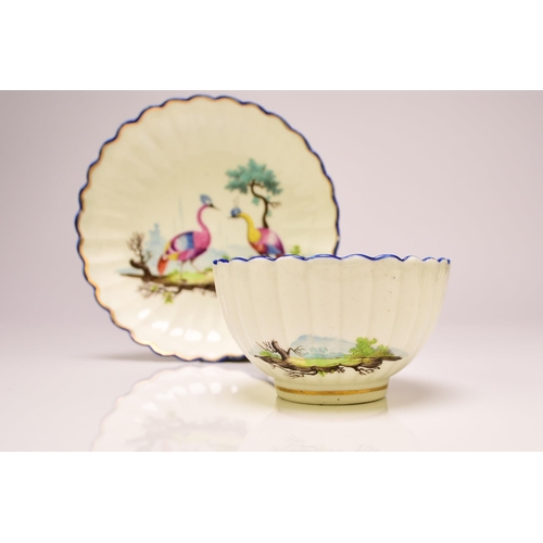 136 - A Caughley porcelain fluted tea bowl and saucer, circa 1783-93, Chamberlain's decorated in polychrom... 