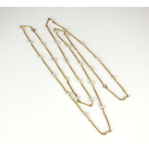 14 - A yellow metal seed pearl set chain, the yellow metal wrythen links set throughout with single seed ... 