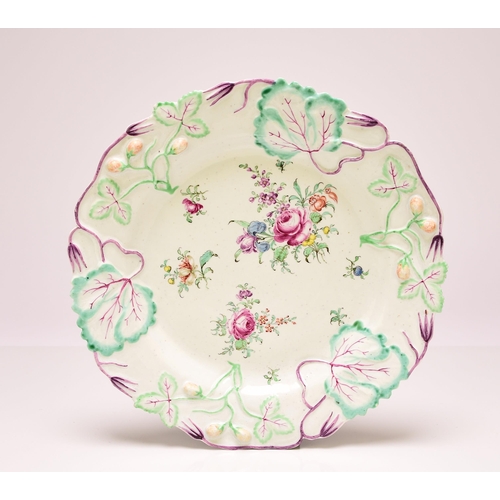 140 - A Longton Hall porcelain strawberry plate, circa 1755-56, the border moulded with leaves and fruitin... 